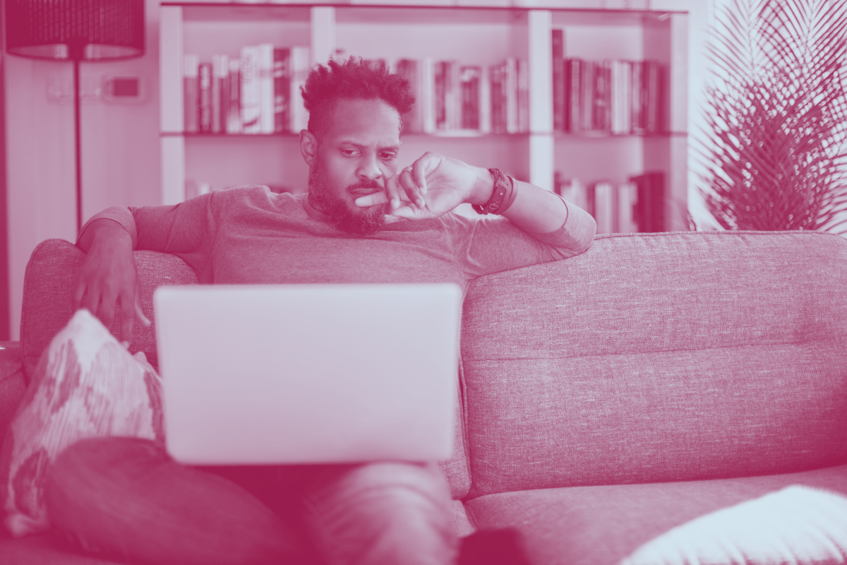 Inclusive sky_neutral adult man with laptop_iStock_1353266761